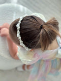 Close-up of pearl and flower embellishments on Petals and Grace Headband