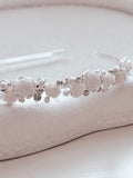 Petals and Grace Headband styled on white jewellery plate