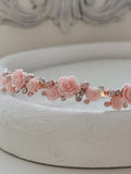 Elegant pink floral headpiece for weddings and special occasions