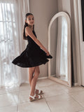 Tween girl in elegant black dress for Year 6 graduation photoshoot