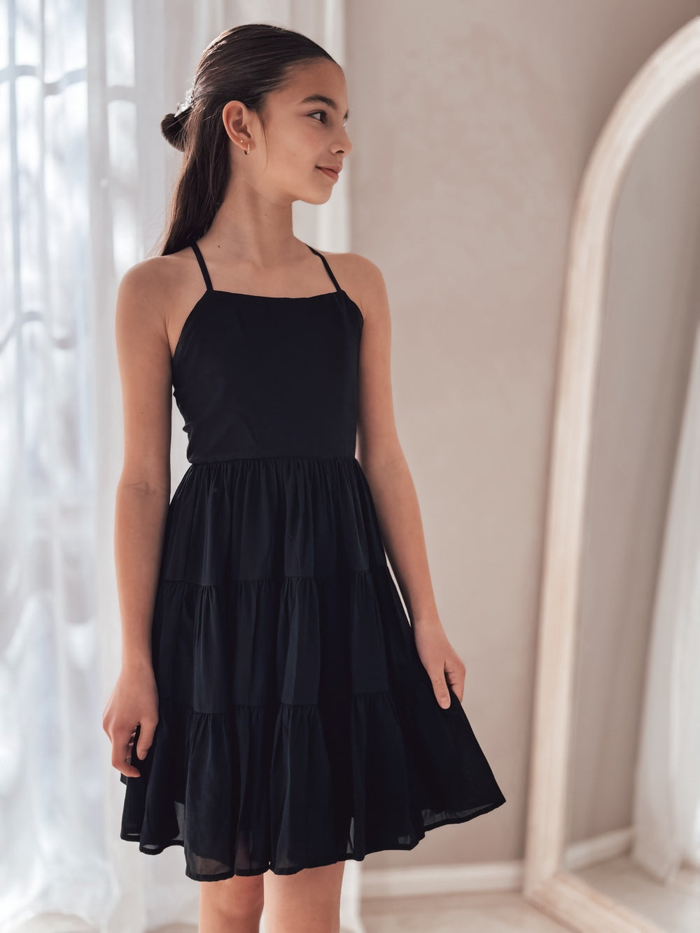 Front view of Phoebe Girls Black Graduation Dress – knee-length chiffon dress with tie-up back
