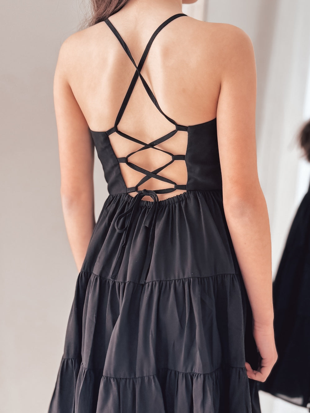 Close-up of chiffon fabric and tie-up back – Phoebe Girls Black Graduation Dress