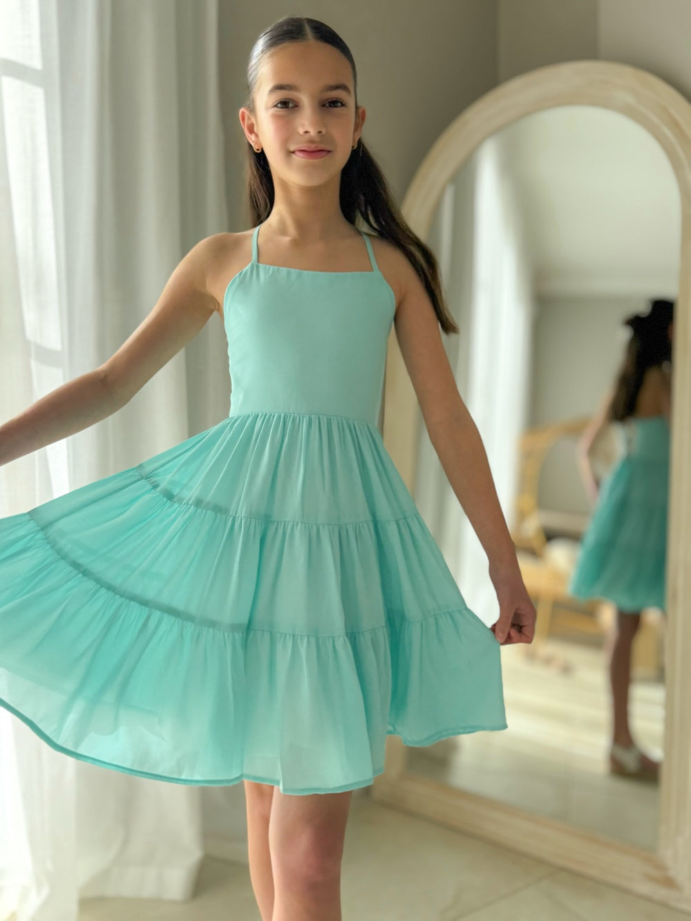Knee-length turquoise dress for Year 6 graduation celebration