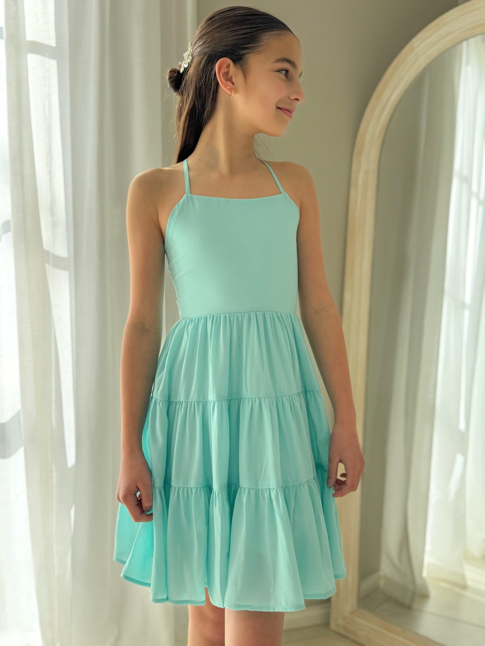 Front view of turquoise girls graduation dress with tiered chiffon skirt