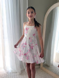 Close-up of soft pink and white floral chiffon fabric with cotton lining