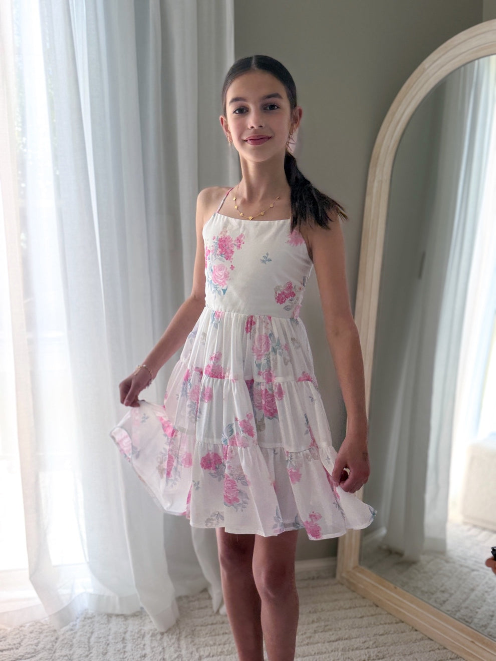 Close-up of soft pink and white floral chiffon fabric with cotton lining