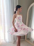 Front view of knee-length pink flower print chiffon dress for Year 6 graduation