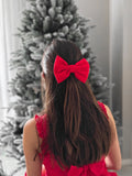 Close-up of Phoebe red girls Christmas bow