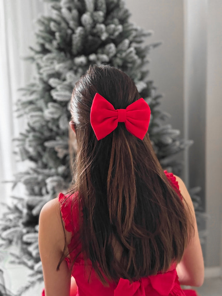 Close-up of Phoebe red girls Christmas bow