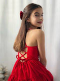 Tween girl in red holiday dress with adjustable bow-tie back