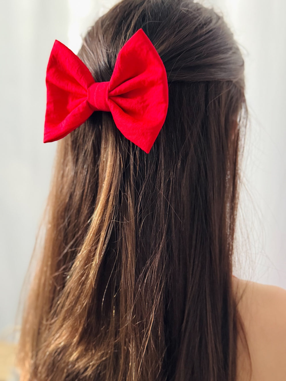 Phoebe Red Girls Hair Bow - All AccessoriesGirls red holiday hair bow styled with Christmas dress