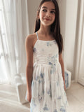 Phoebe dress front view showing soft floral print and layered skirt