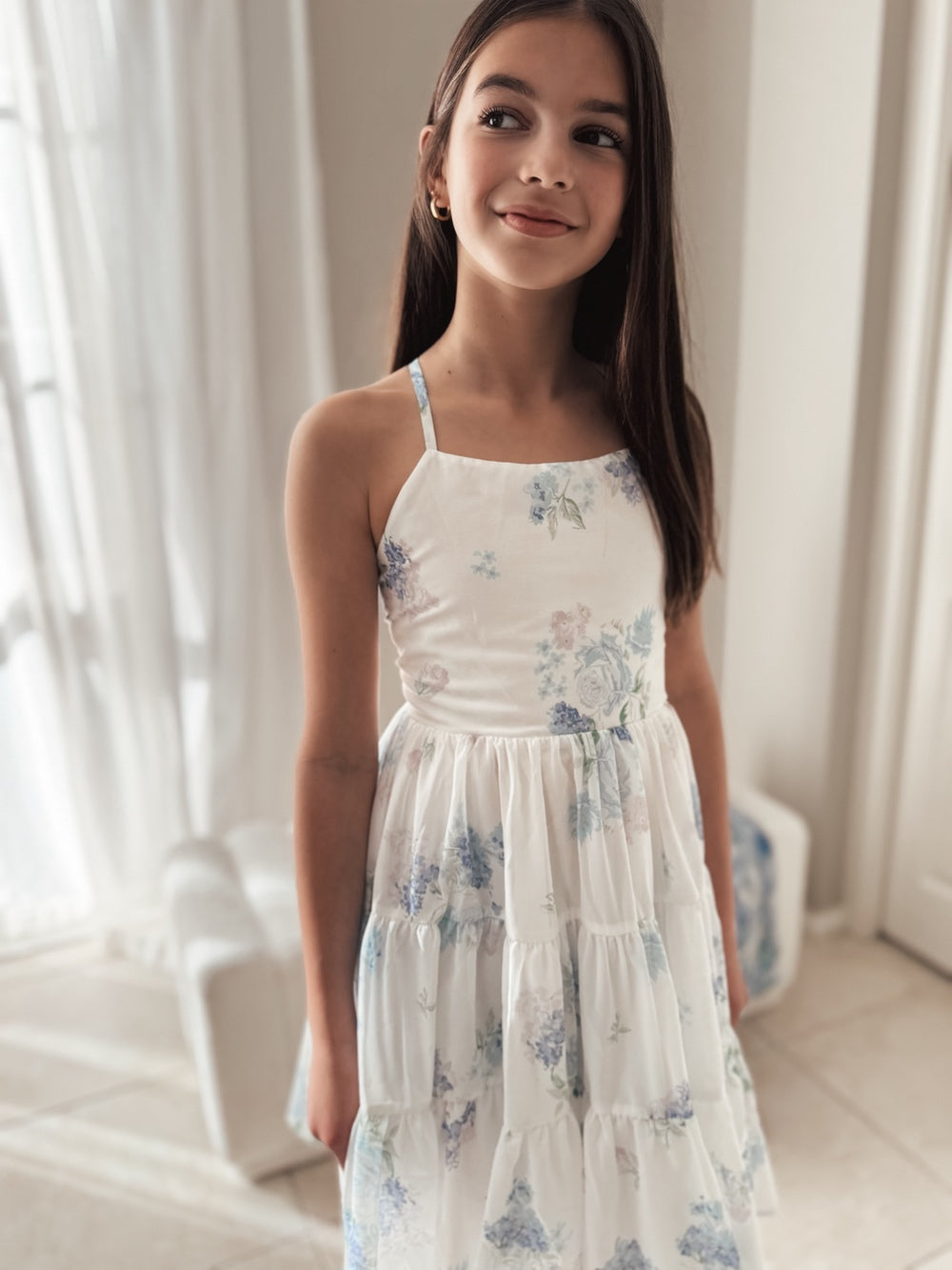 Phoebe dress front view showing soft floral print and layered skirt