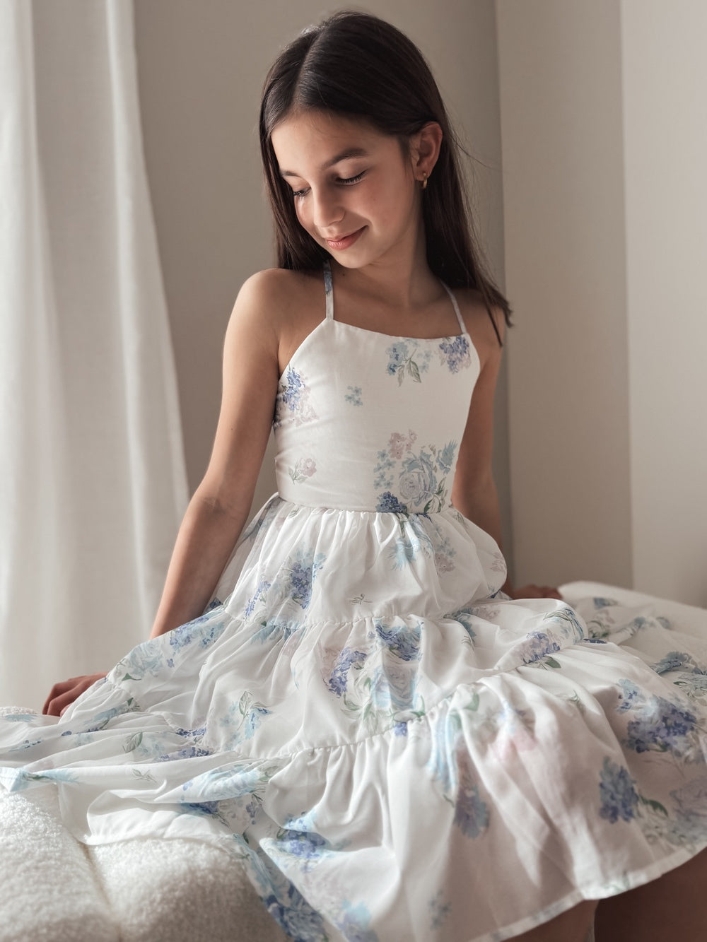 Phoebe Chiffon Girls Dress Blue Floral - Tween Girls DressesChiffon floral dress spread in soft layers while seated – Phoebe graduation dress