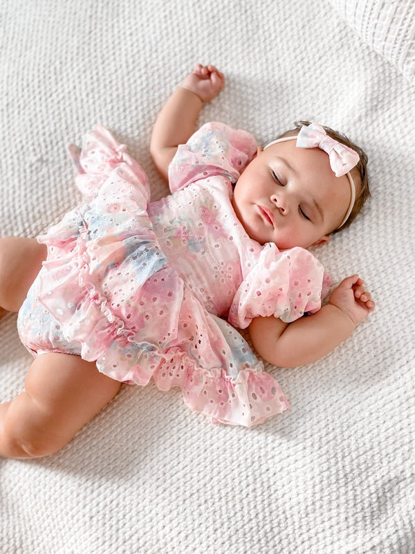 Baby girls rainbow pink baby romper - sleeping