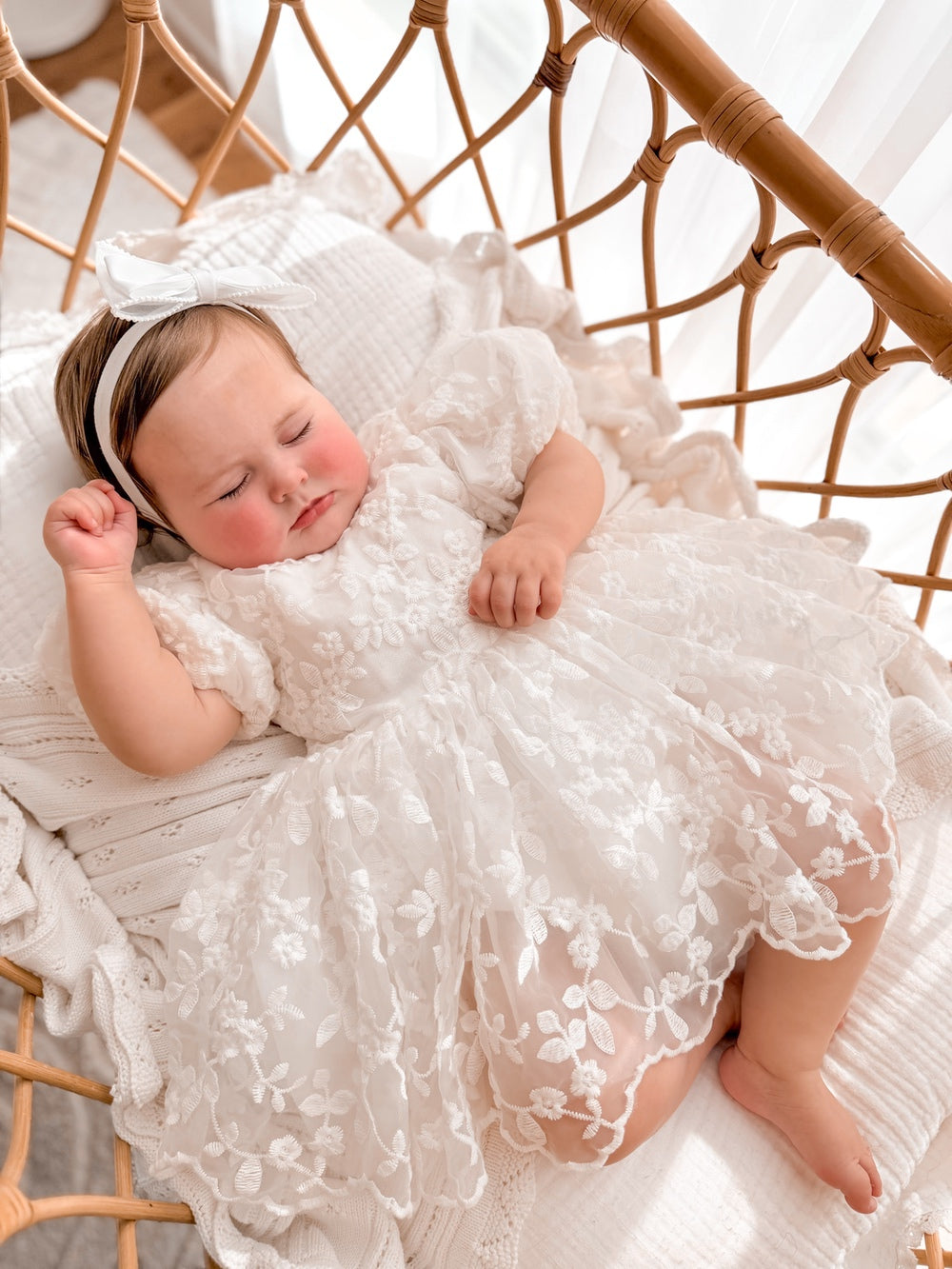 White baby christening dress with embroidered floral tulle