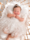 Penelope ivory baby dress back view with statement bow