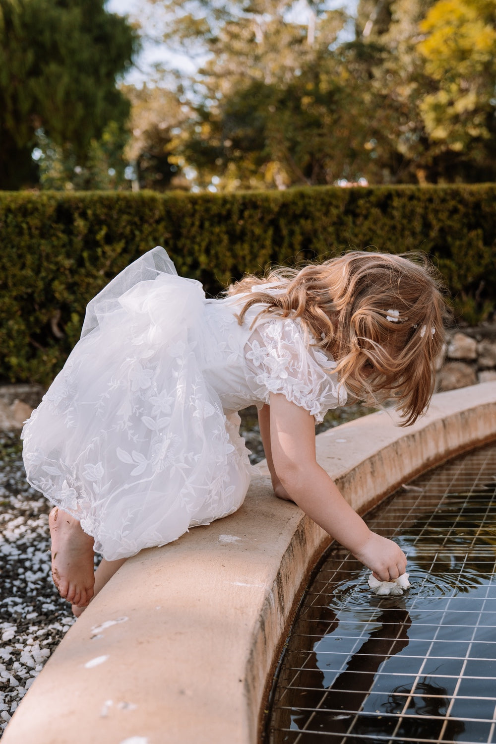 Girls white party dress with floral embroidery and tulle details
