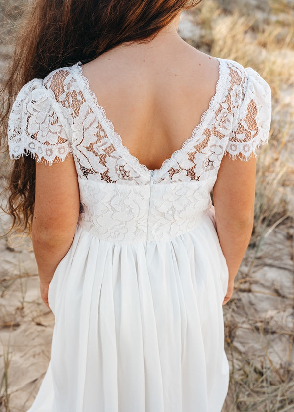 Back view of Sasha dress featuring V-back and zipper closure