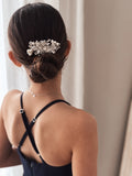 Elegant silver hair accessory with blooming flower and diamante details