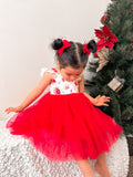 Front view of red floral girls Christmas dress with tulle skirt and ruffle shoulders