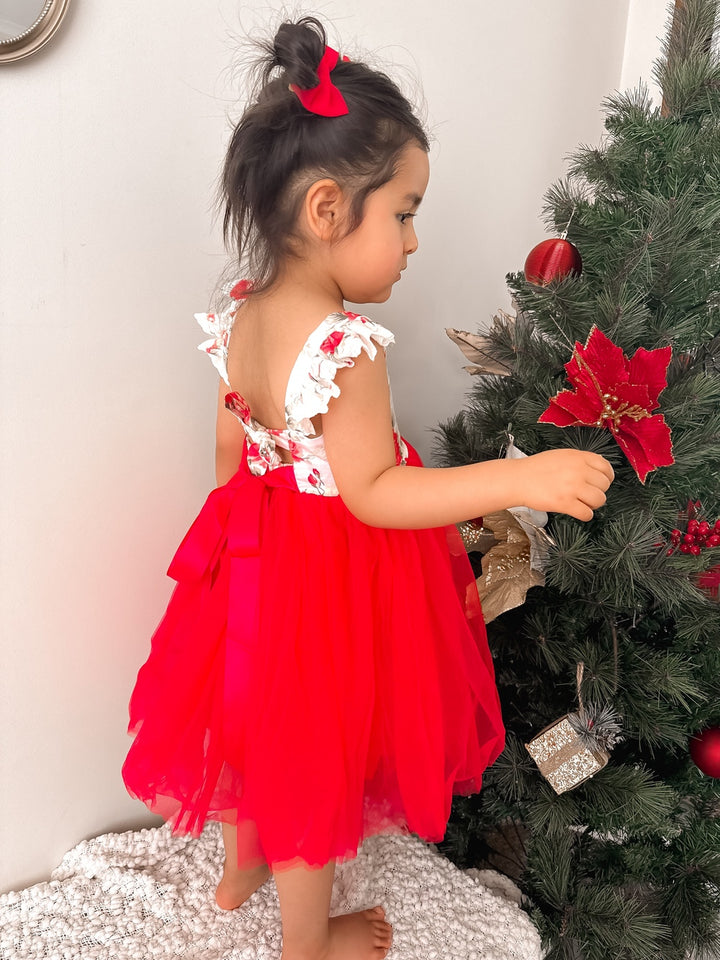 Back view of Stella Rose Christmas Dress showing tie-up bow and elasticated waist