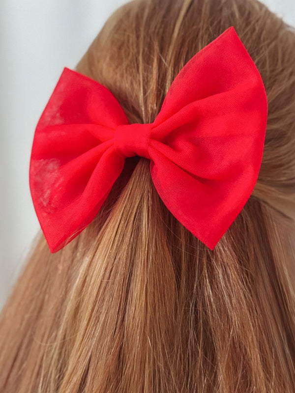 Stella Rose Bow - Red - Christmas Dresses and RompersMedium red tulle Christmas bow clipped in half-up hairstyle