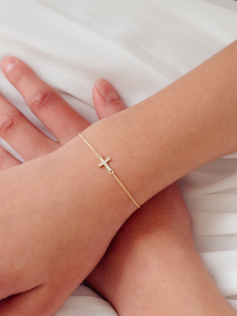 Girls gold keepsake bracelet with cross charm