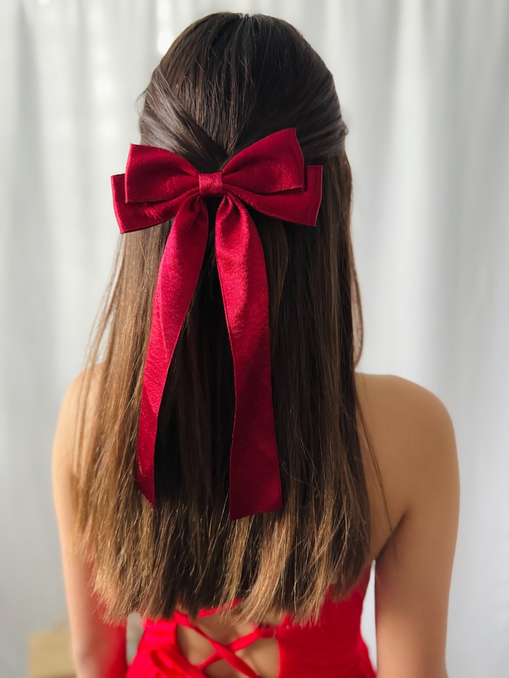 Red Shimmer Girls Hair Bow - Christmas AccessoriesGirls hairstyle with long red velvet shimmer bow for Christmas