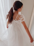 White Communion dress for girls with puff sleeves and floaty tulle