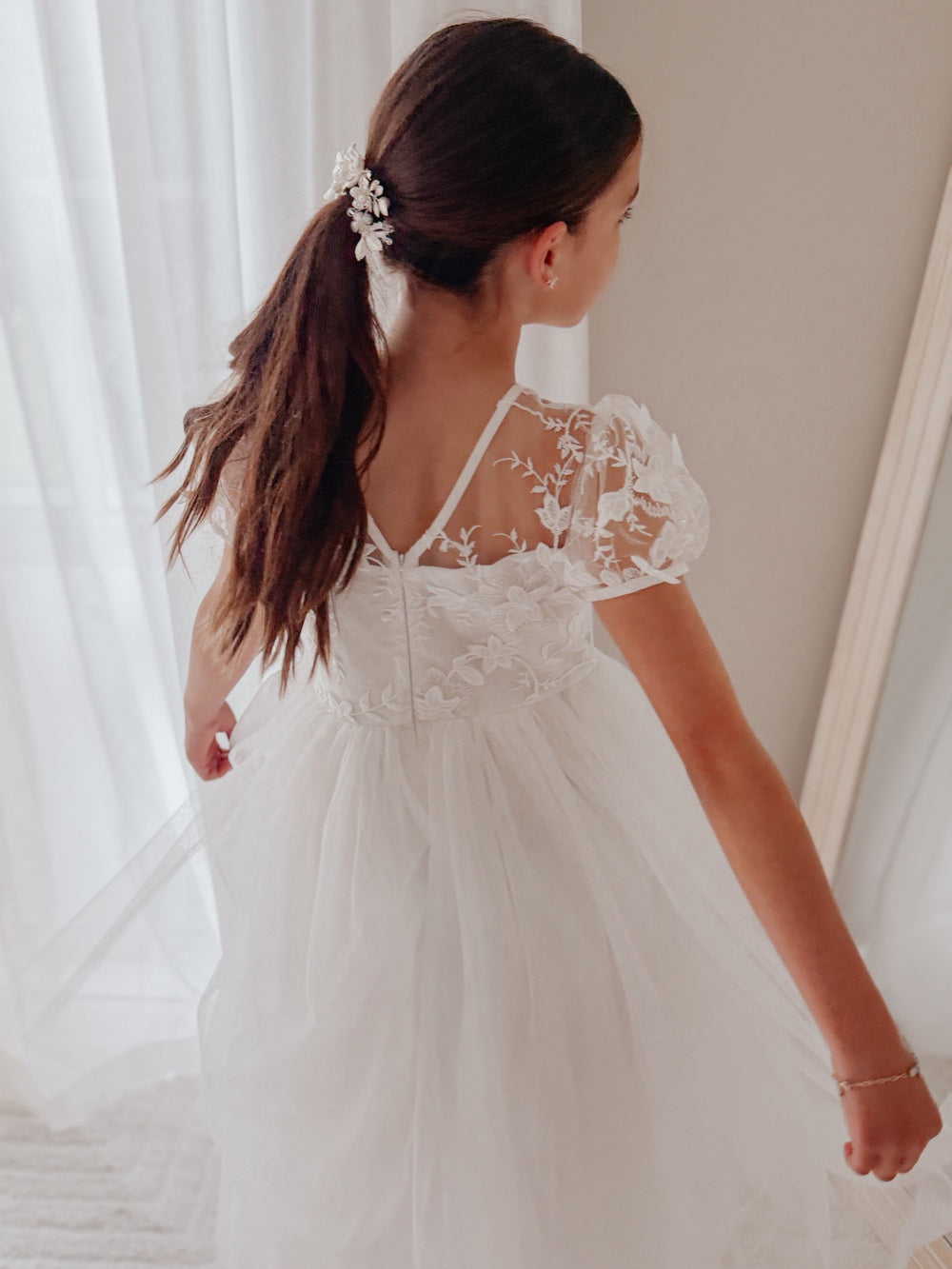White Communion dress for girls with puff sleeves and floaty tulle