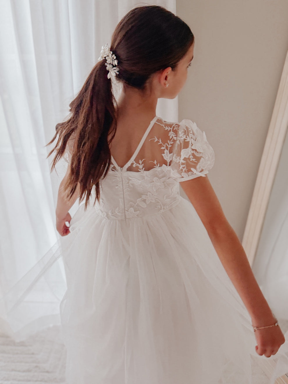 White Communion dress for girls with puff sleeves and floaty tulle