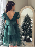Green girls Christmas dress with oversized tulle bow and V-back