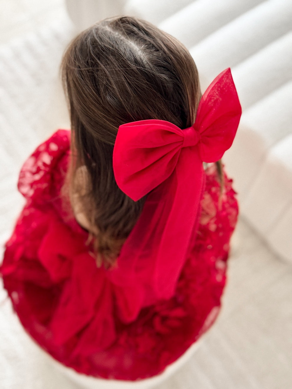 Vienna Red Dress styled with matching long red tulle hair bow