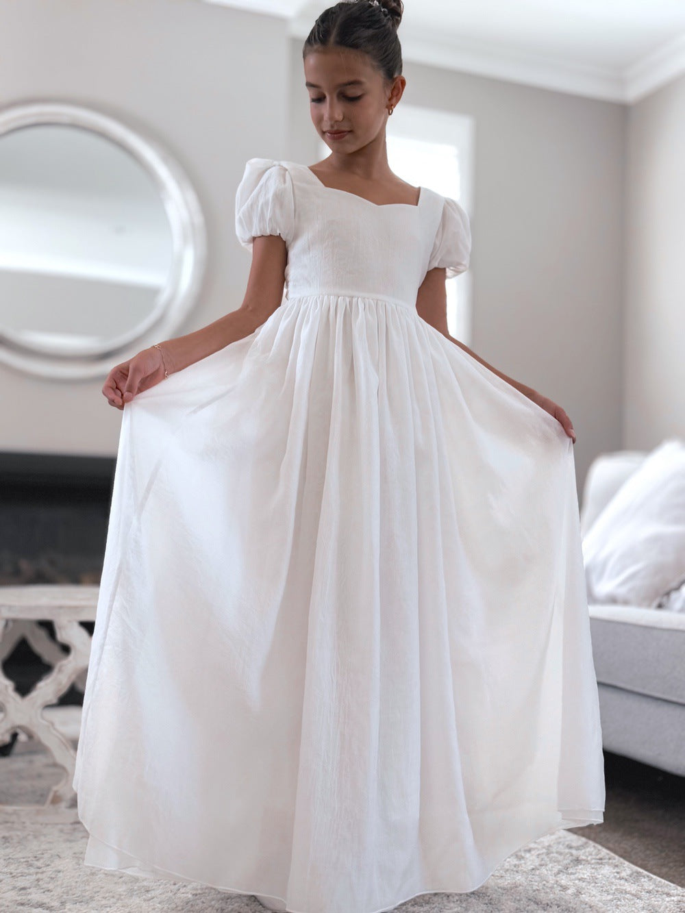 Full-length skirt on Valentina white flower girl dress