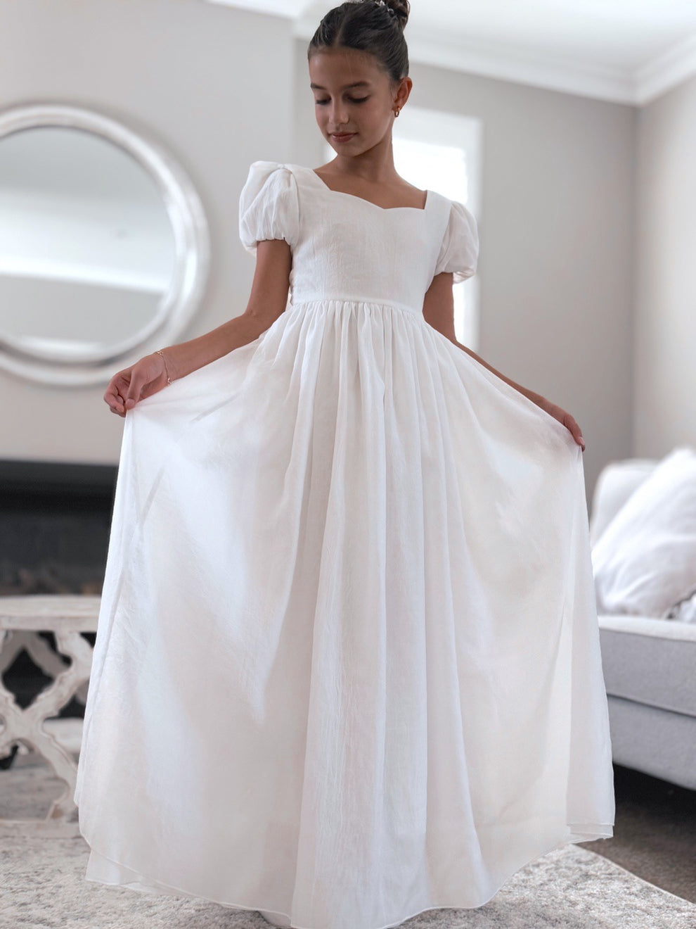 Full-length skirt on Valentina white flower girl dress