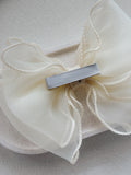 Elegant ivory wavy bow accessory for weddings and Communions