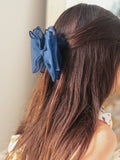 Navy blue girls bow with wavy design – perfect hair accessory for weddings and special occasions