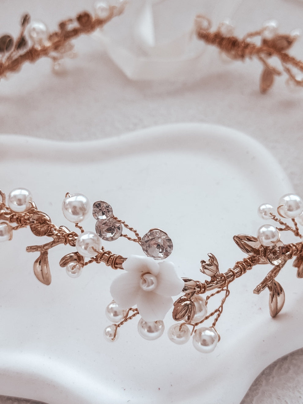 Elegant gold headpiece with pearls and porcelain flowers for weddings