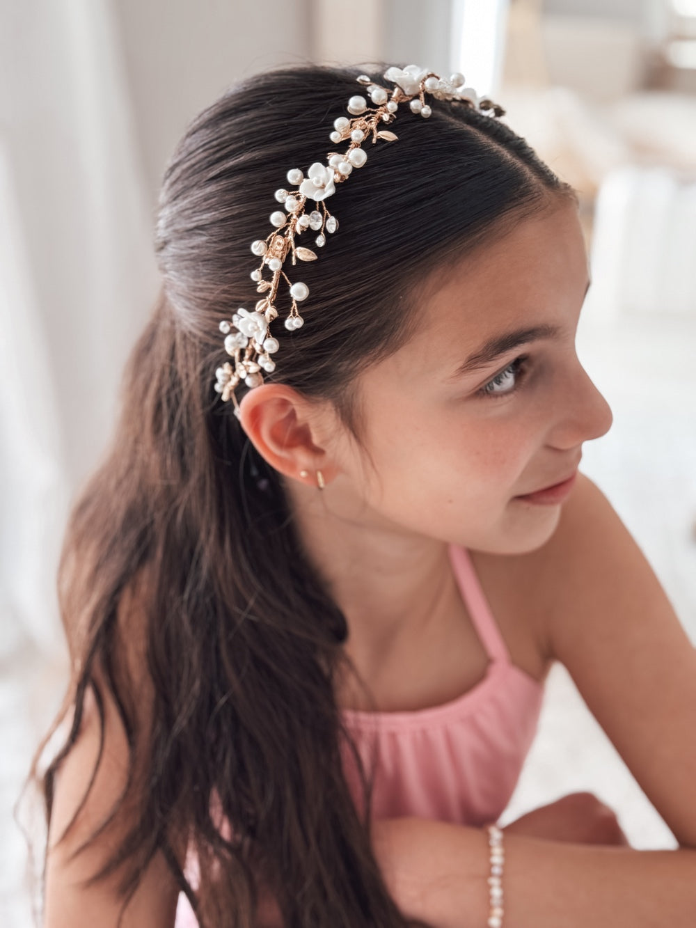 Girl wearing Whispering Blooms Girls Gold Headpiece with porcelain flowers and pearls