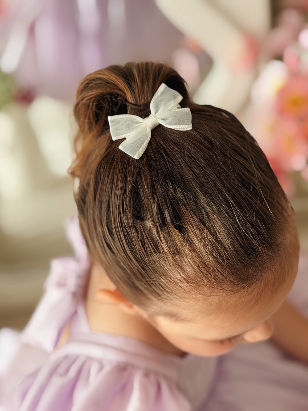 Matching white bow clips for sisters