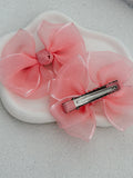 Blush peach pigtail bow clips for birthdays and weddings