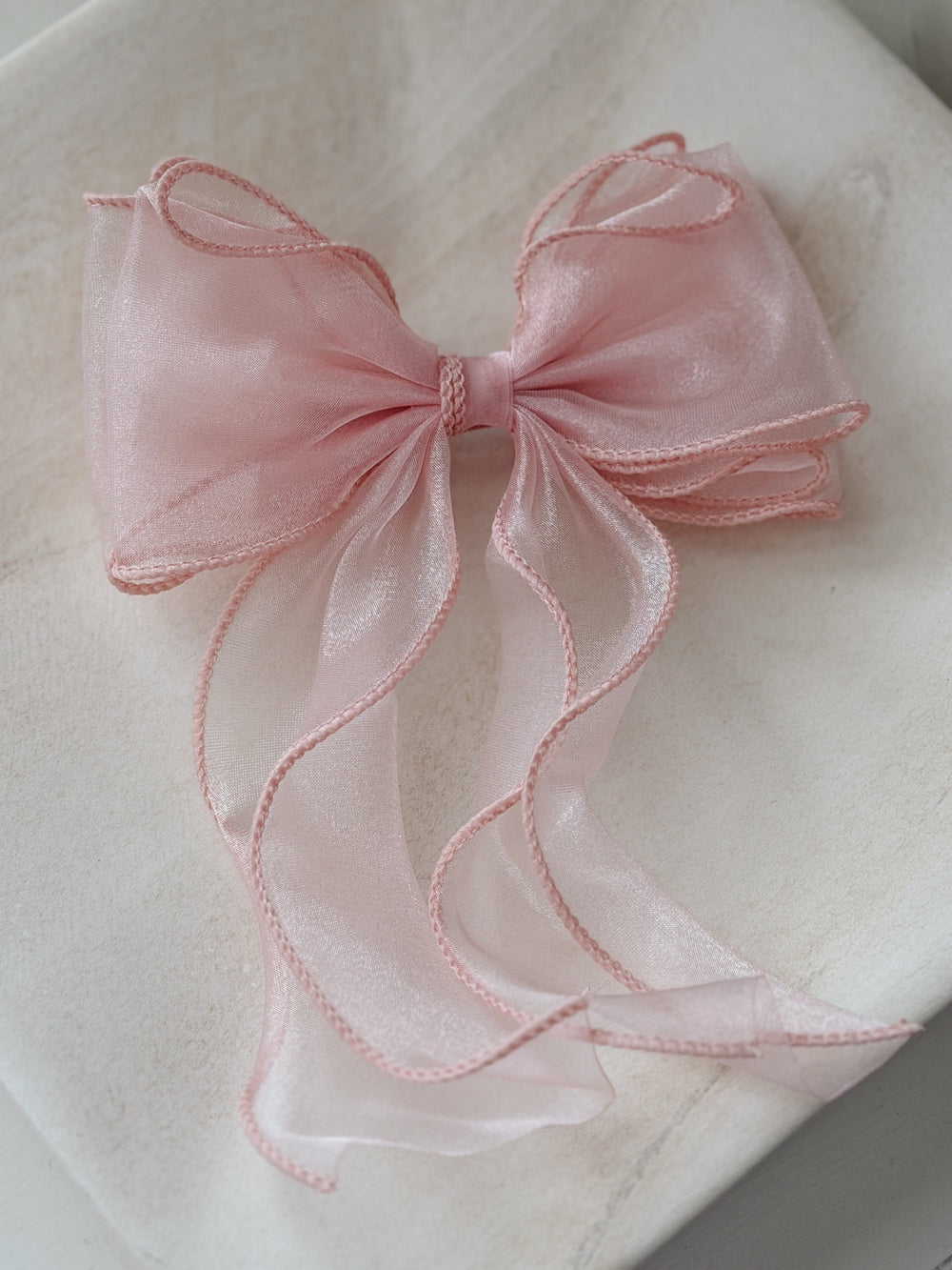Light pink organza curly girls hair bow with flowing tails