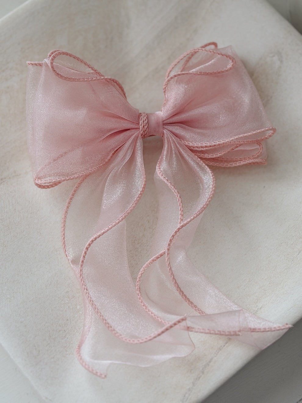Light pink organza curly girls hair bow with flowing tails