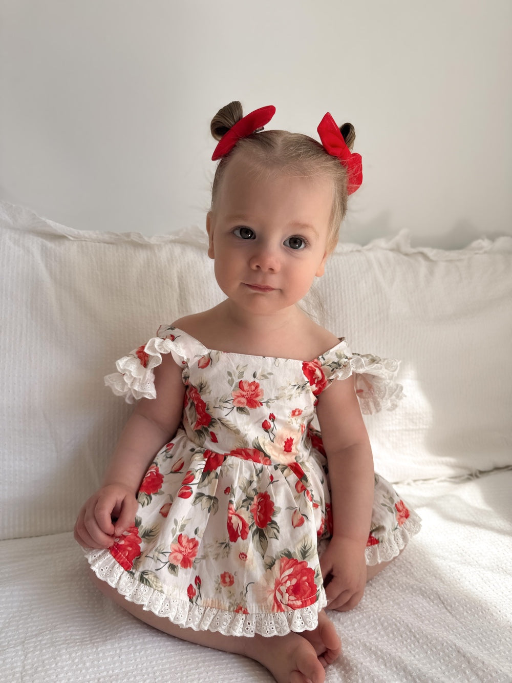 Olive Baby Girls Floral Christmas Romper - Christmas Dresses and RompersBaby smiling in Olive Floral Christmas Romper wearing matching headband and gold bracelet