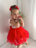 Front view of Stella Rose Floral Christmas Dress – ruffle shoulders and festive red floral details