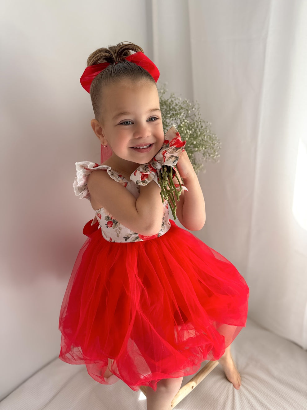 Front view of Stella Rose Floral Christmas Dress – ruffle shoulders and festive red floral details