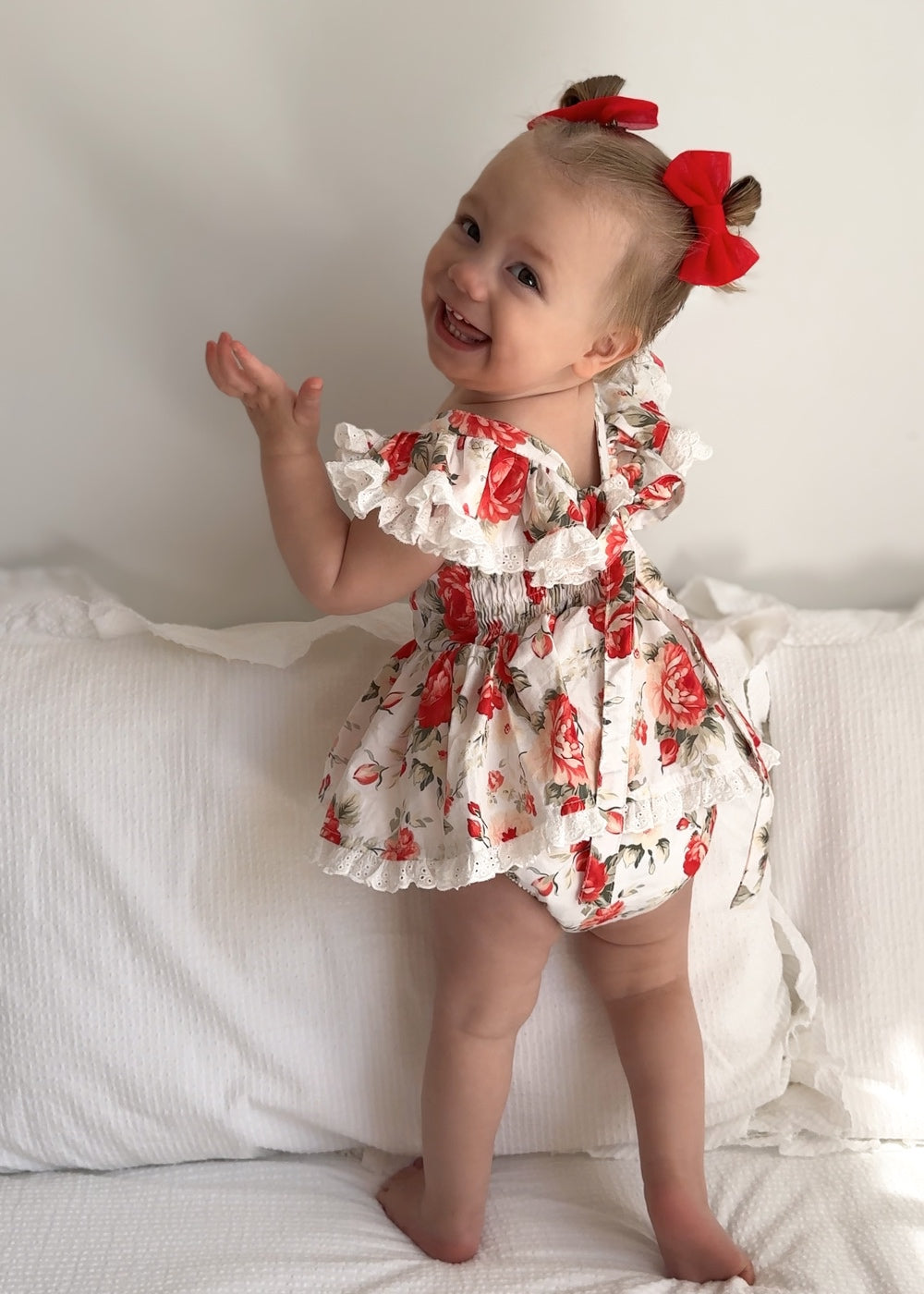 Olive Baby Girls Floral Christmas Romper - Christmas Dresses and RompersBack view of Olive Baby Girls Christmas Romper with broderie anglaise ruffles and soft cotton fabric