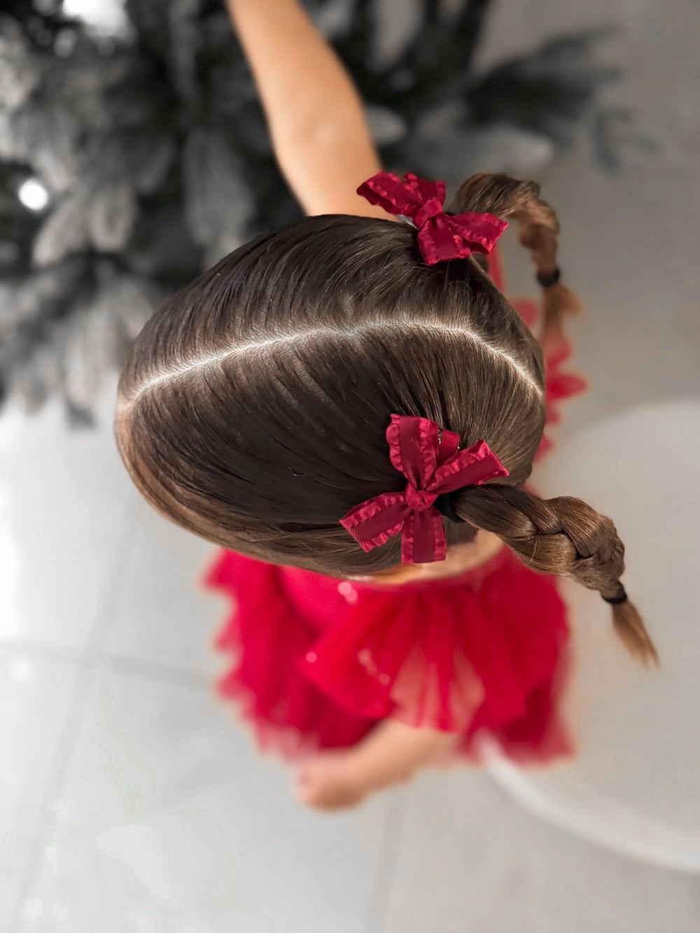 Mini Red Christmas Girls Pigtail Bows - Christmas Dresses and RompersMini red Christmas pigtail bows styled in toddler hair