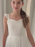 Girls white tulle skirt dress twirling shot